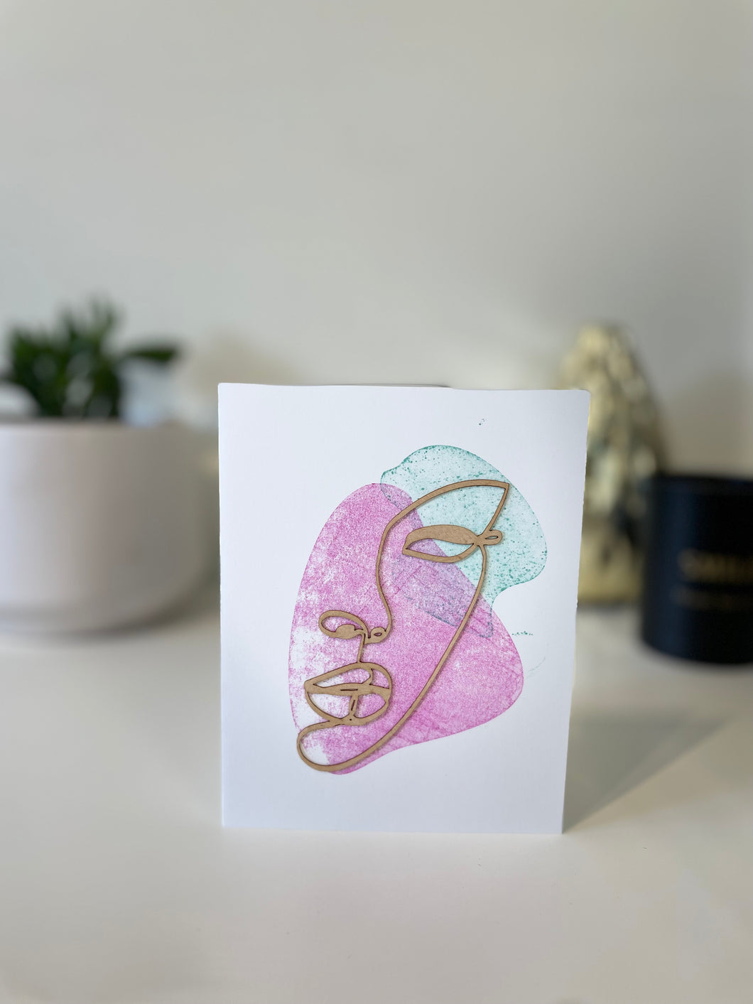 Woman face greeting card with wooden design